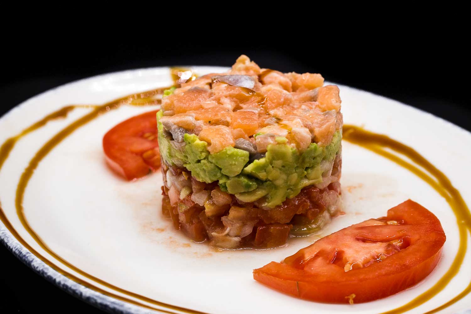 Tartar with salmon, avocado and tomato