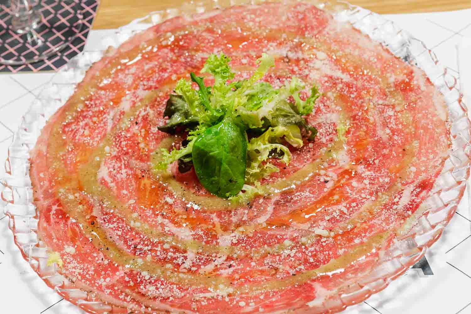 Carpaccio of iberian pork shoulder with aroma of sage and Parmesan