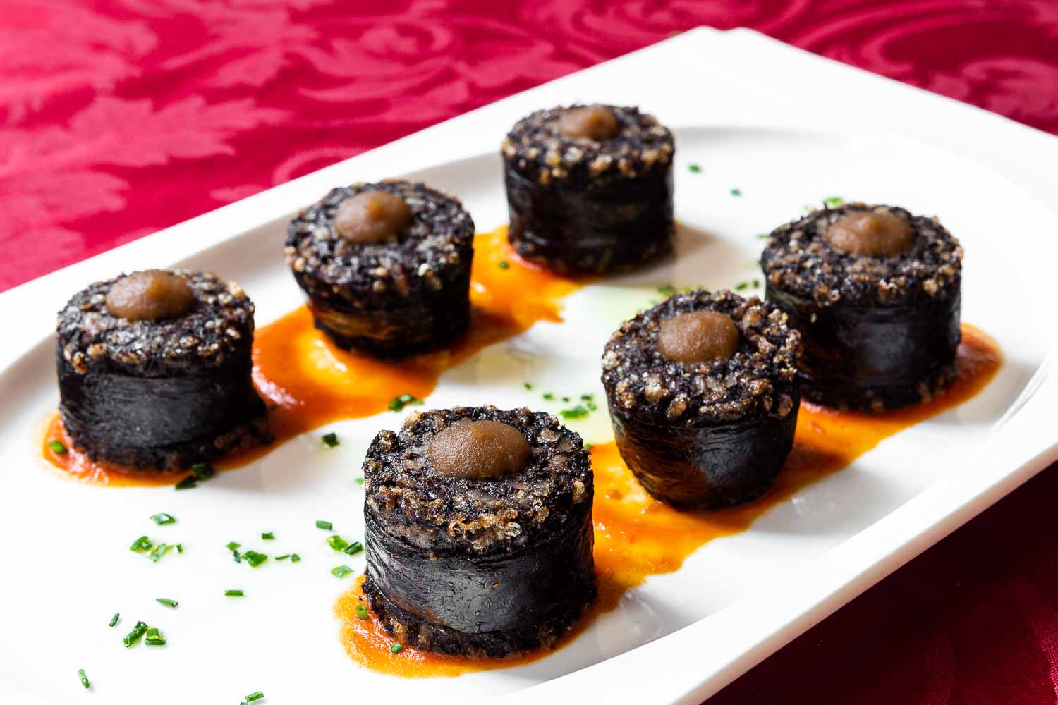 Morcilla de Burgos skewer and piquillos with candied apple