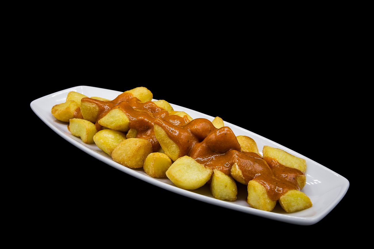 Fried potatoes with spicy sauce