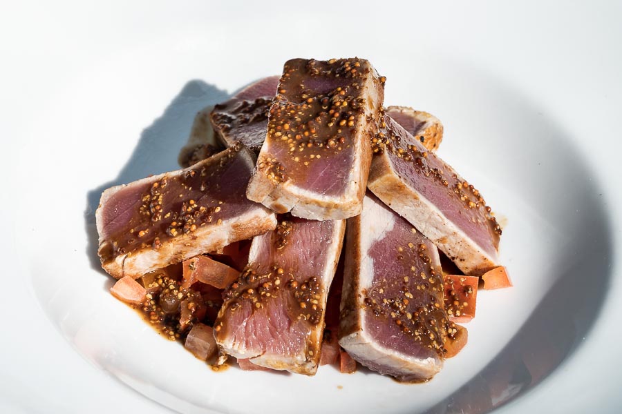 Tuna with soy and moustard sauce on tomato vinaigrette