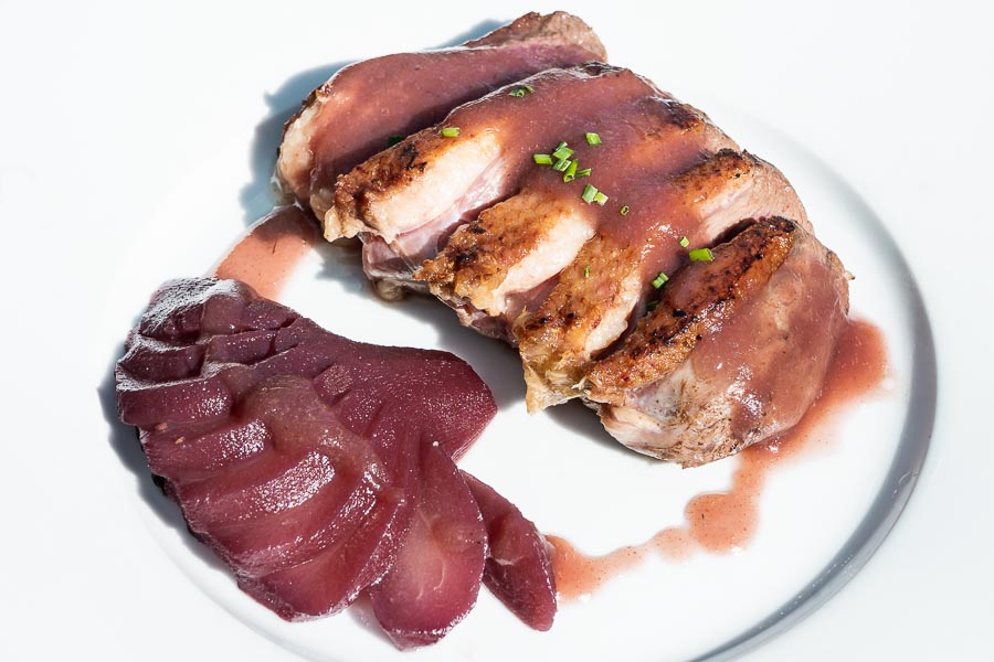 Duck breast with pears poached in red wine