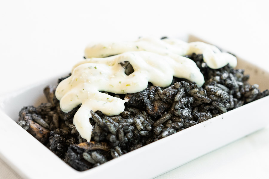 Black rice paella with small cuttlefish
