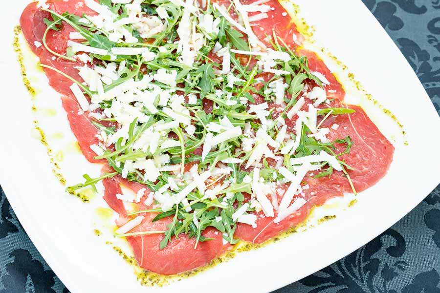 Veal Carpaccio with arugula and parmesan cheese 