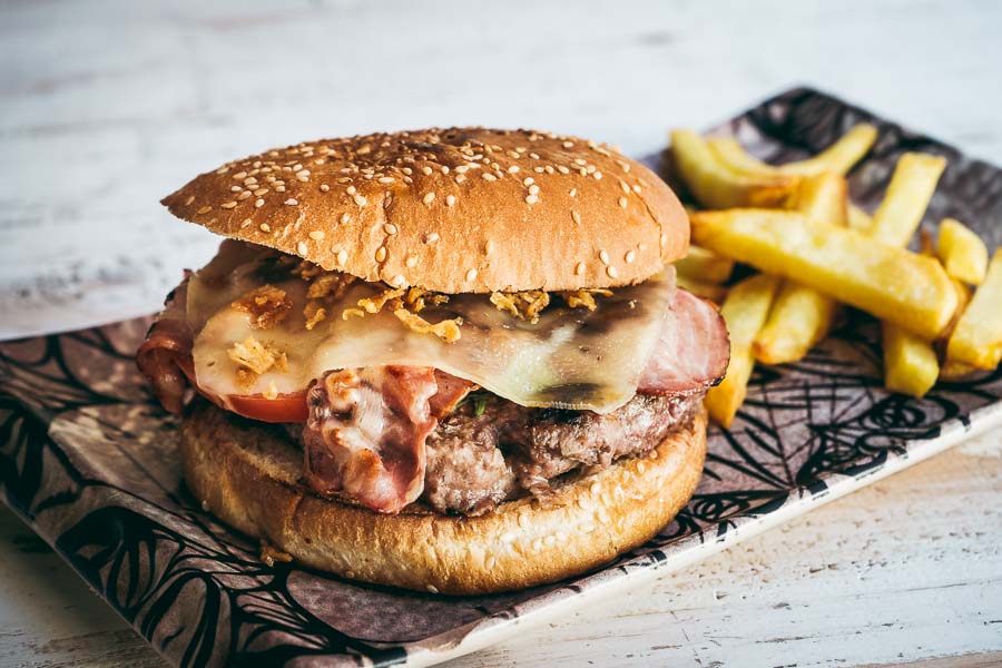 Beef burger with cheese, tomato, onion and crunchy bacon