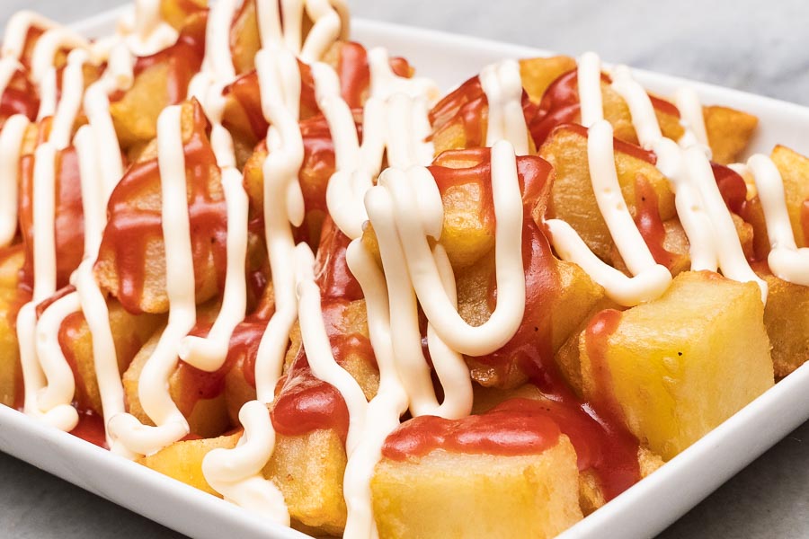 Fried potatoes with mayonnaise and ketchup