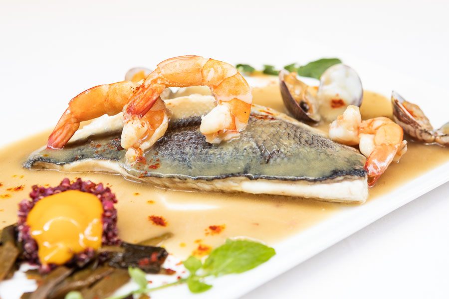 Baked gilthead bream, clams and prawns
