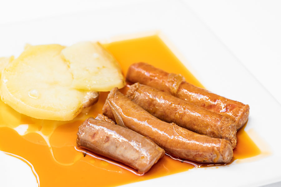 Sausage with spicy paprika with onion and wine