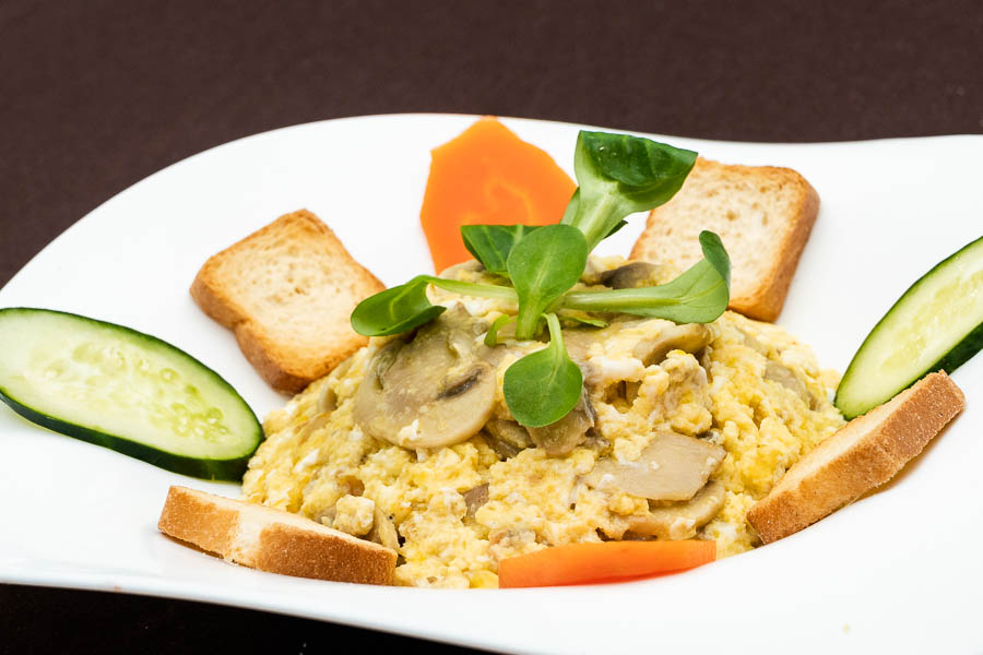 Scrambled eggs with mushrooms and shrimps