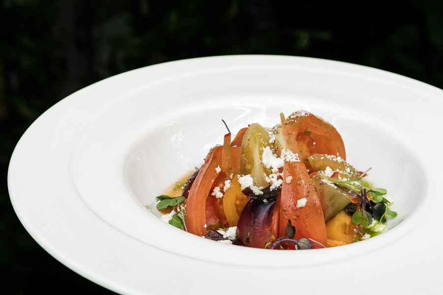 Tomato salad with goat cheese, homemade marinated