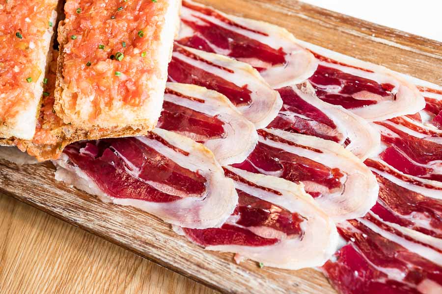 Ibéric acorn-fed ham from Guijuelo D.O. with crystal bread & tomato.