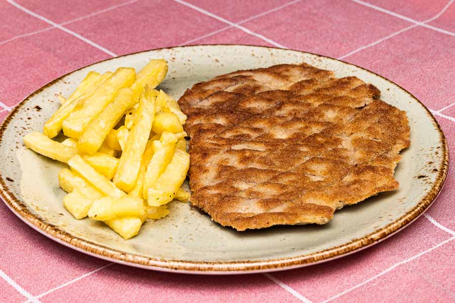 Schnitzel breaded with french fries