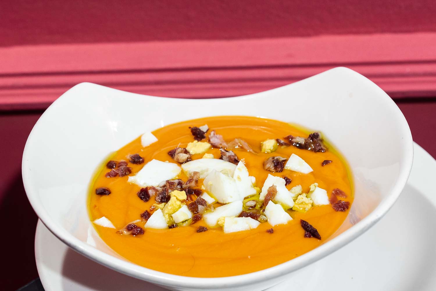 Cold tomato soup with iberian ham and egg