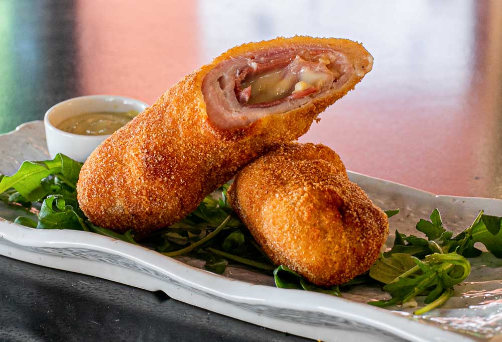 Breaded pork loin, stuffed with cured ham and blue cheese