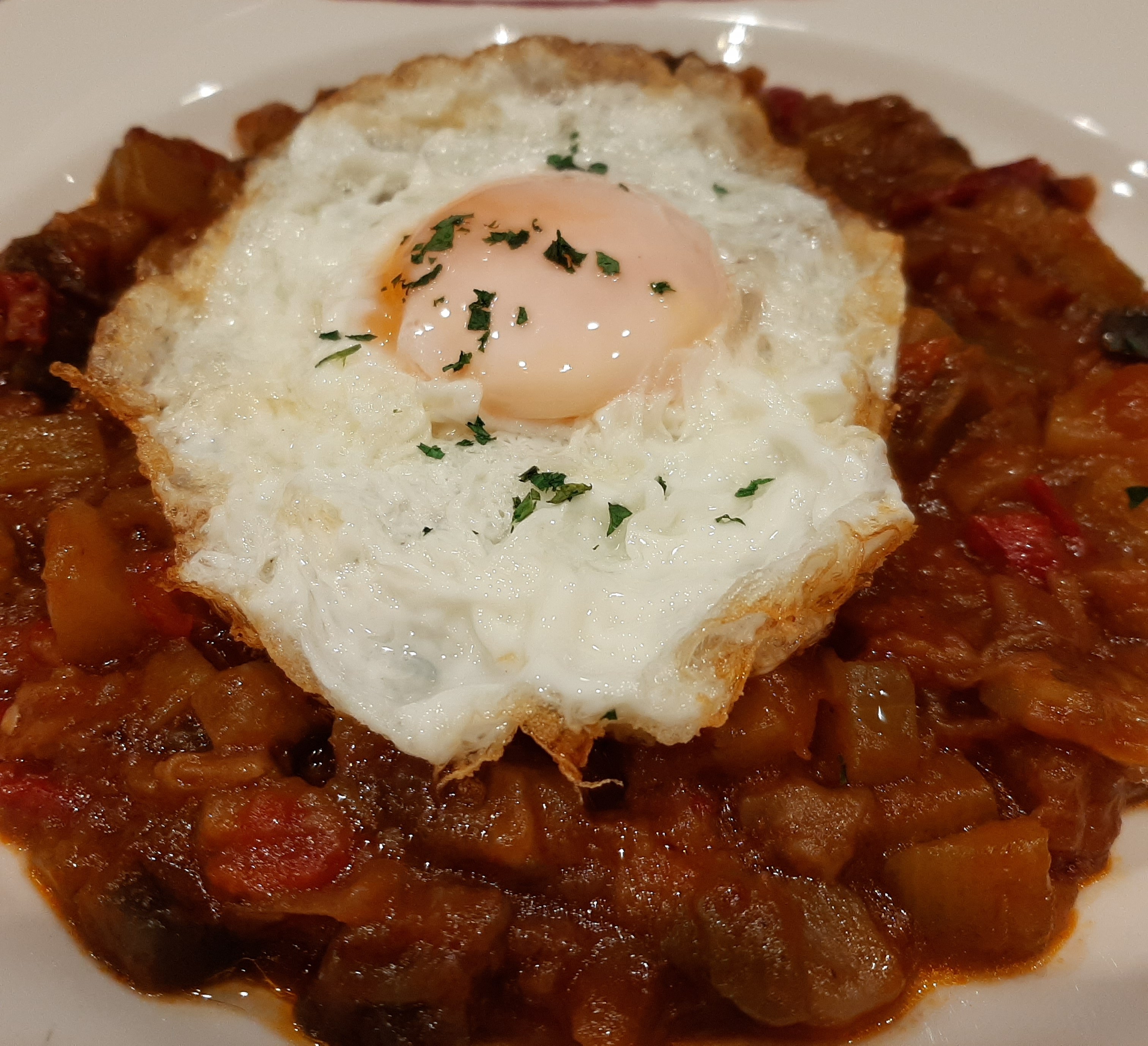 Basque-style ratatouille with fried egg