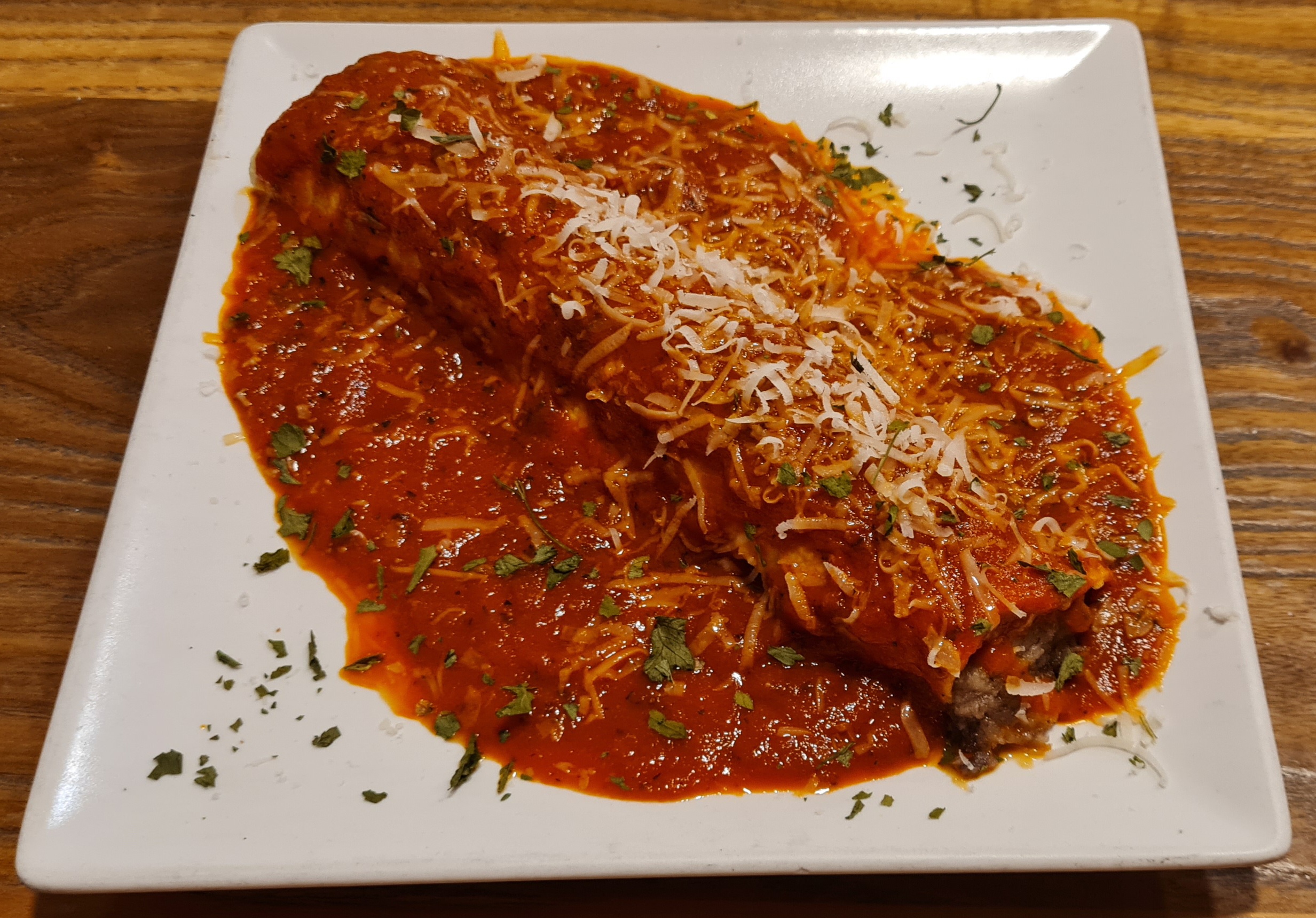 Cannelloni stuffed with roast beef with homemade tomato and basil sauce and parmesan cheese
