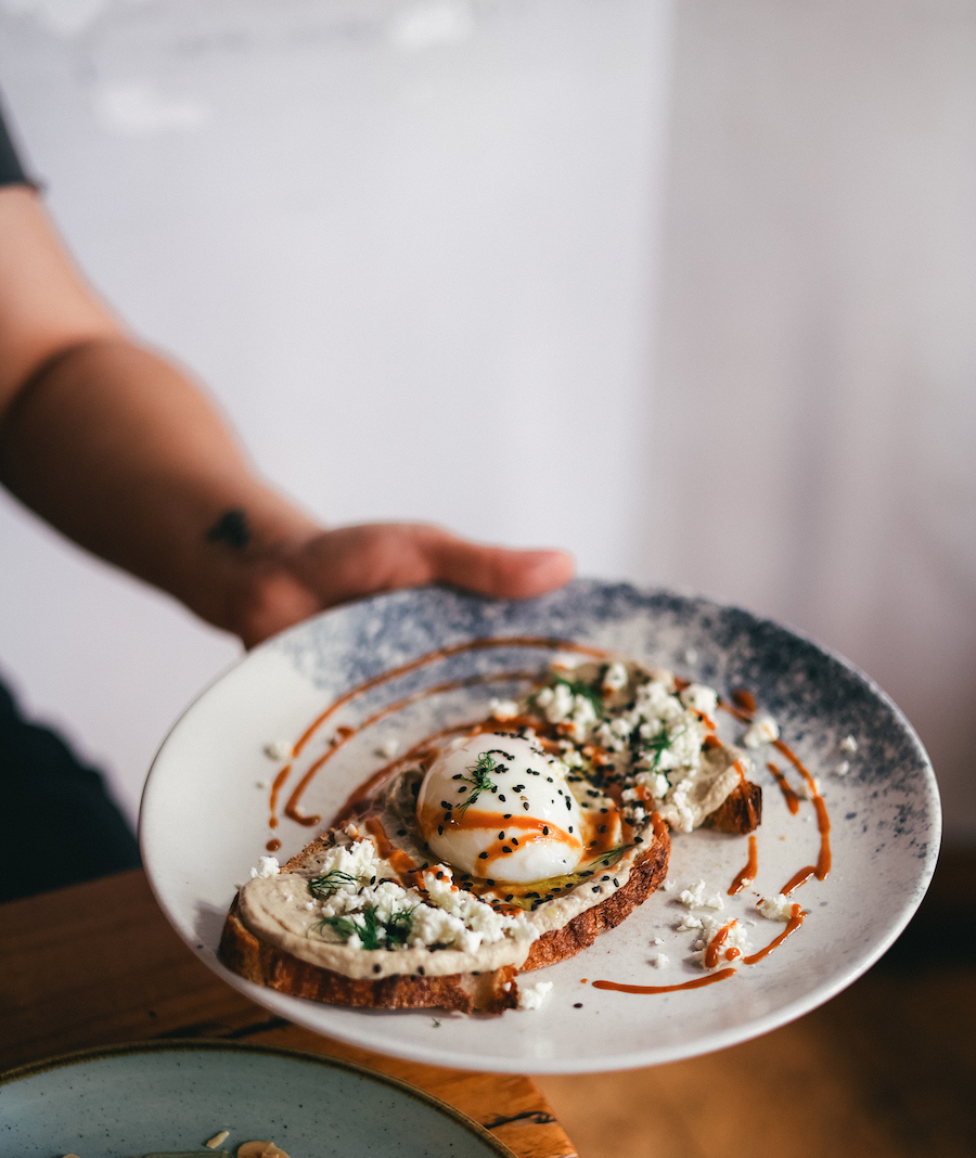 LA BABA: Aubergine puree toast with poached egg, feta cheese, dill, hazelnuts and our miso sauce