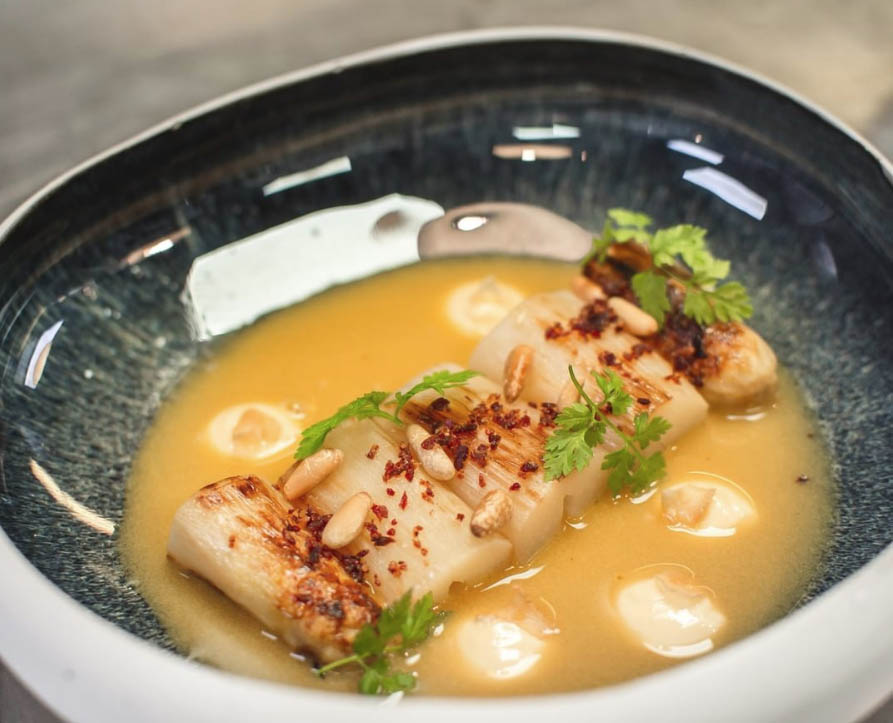 White Asparagus from the Pyrenees, Roasted Pine Nuts and Light Chicken Broth in Pepitoria
