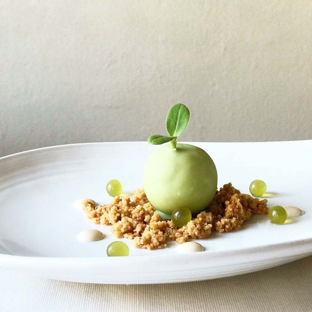 Granny smith sphere of duck foie, almonds crumble and white chocolate