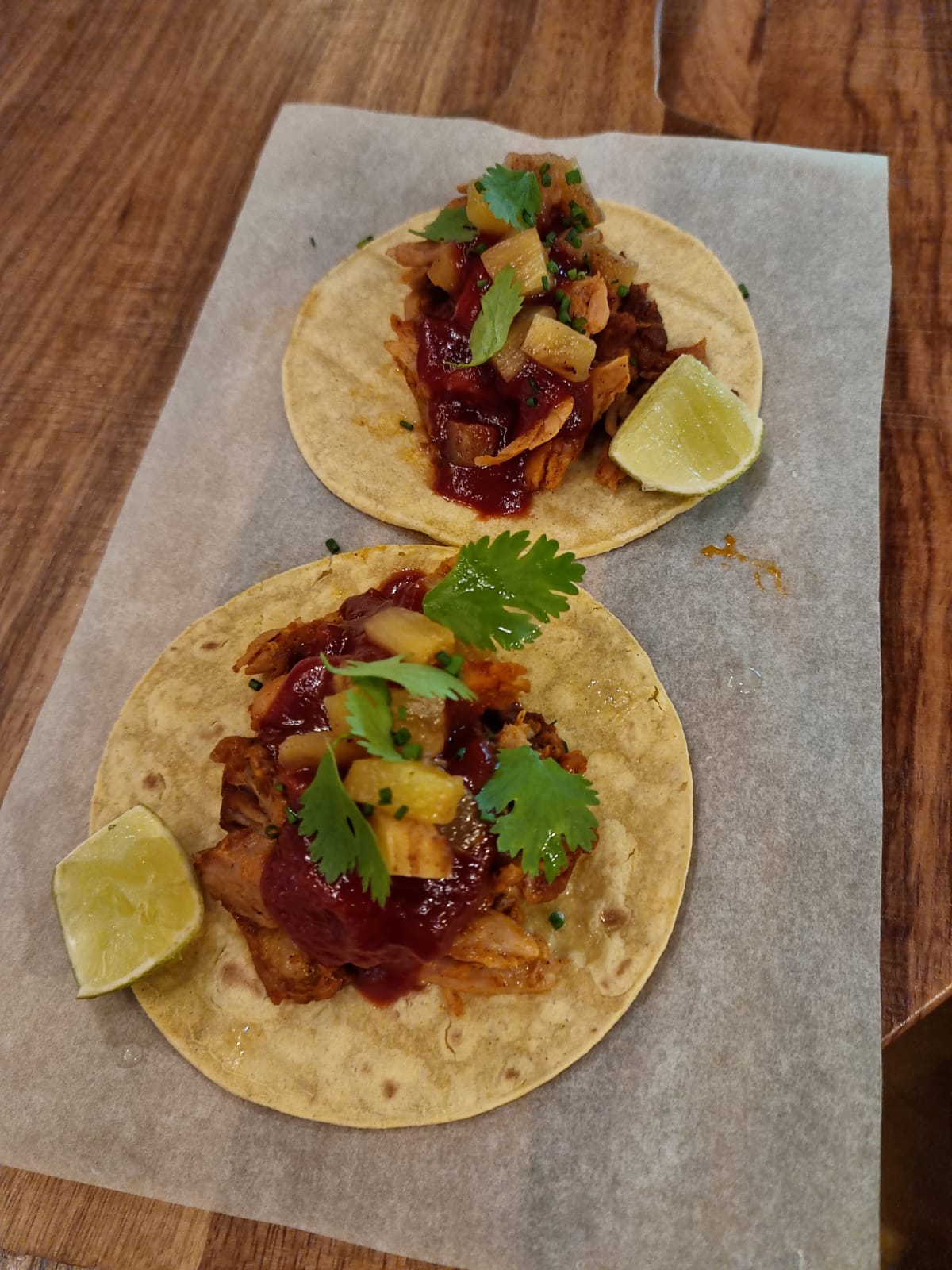 Tacos with pork, grilled pineapple and barbecue sauce
