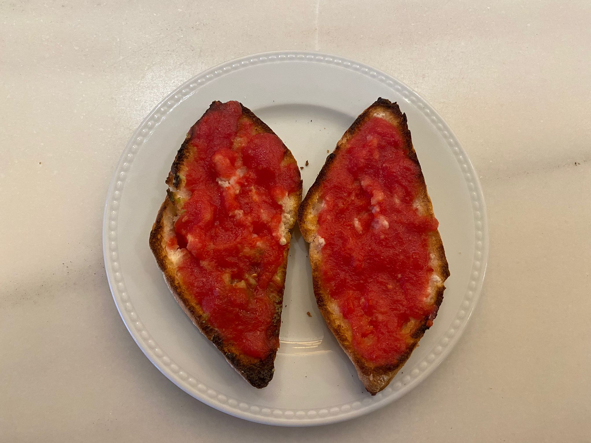 Toast with oil and crushed tomato or slice