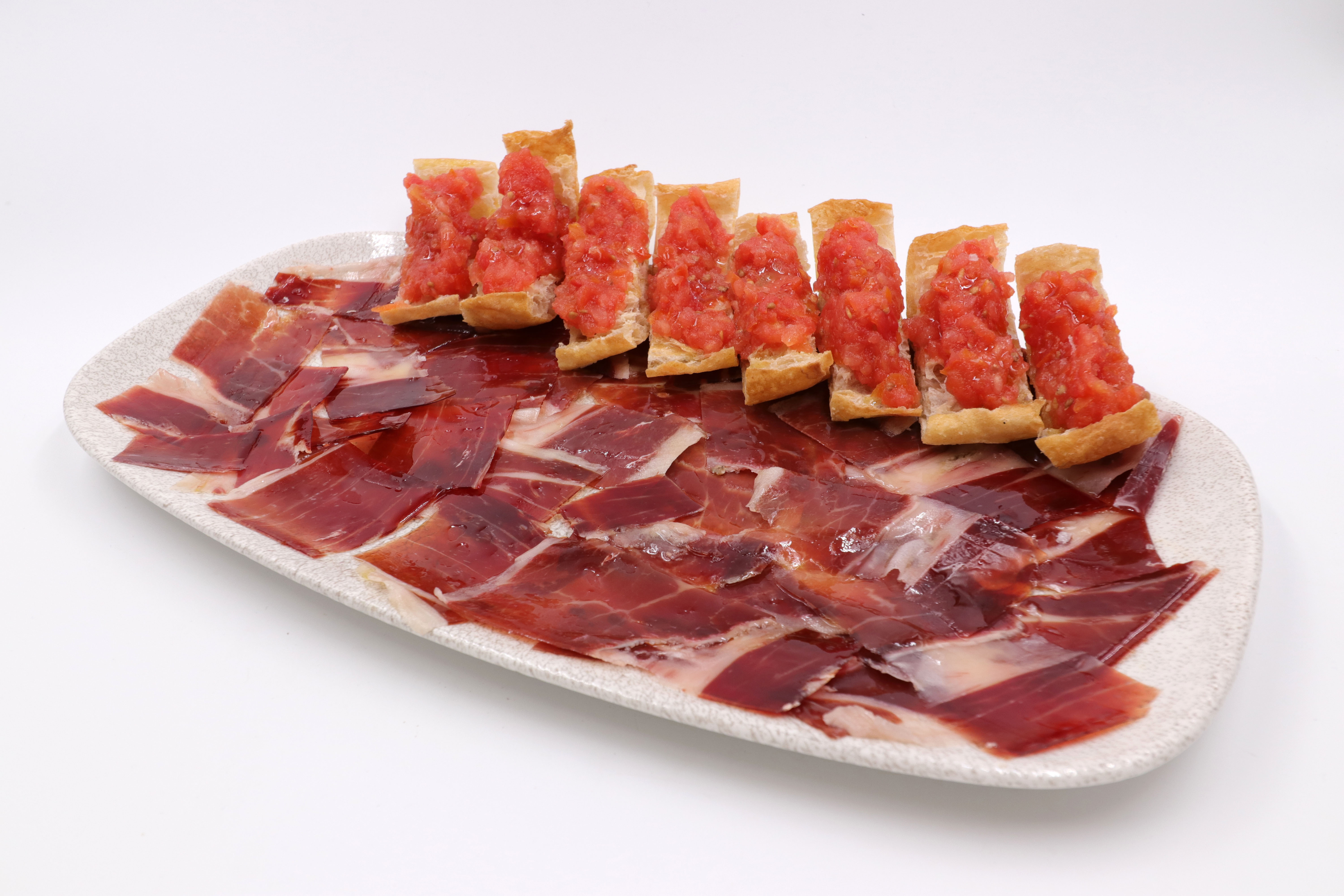 Acorn-fed Iberian ham with bread and tomato