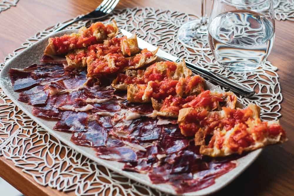 100% Iberian Ham with crystal bread, grated tomato and extra virgin olive oil