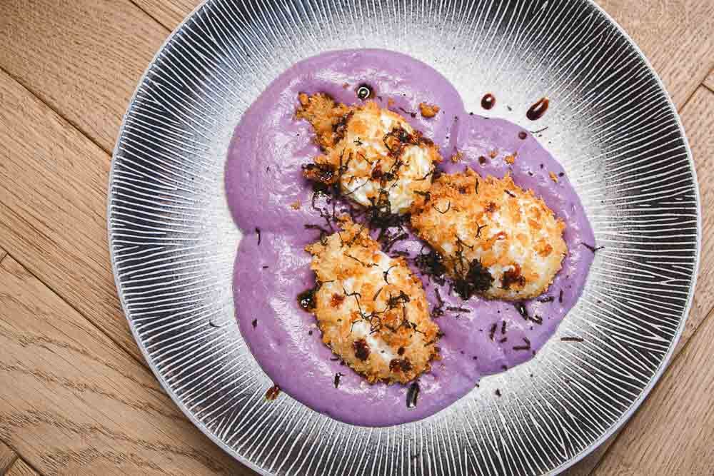 "Divorced eggs", purple potato foam and truffle