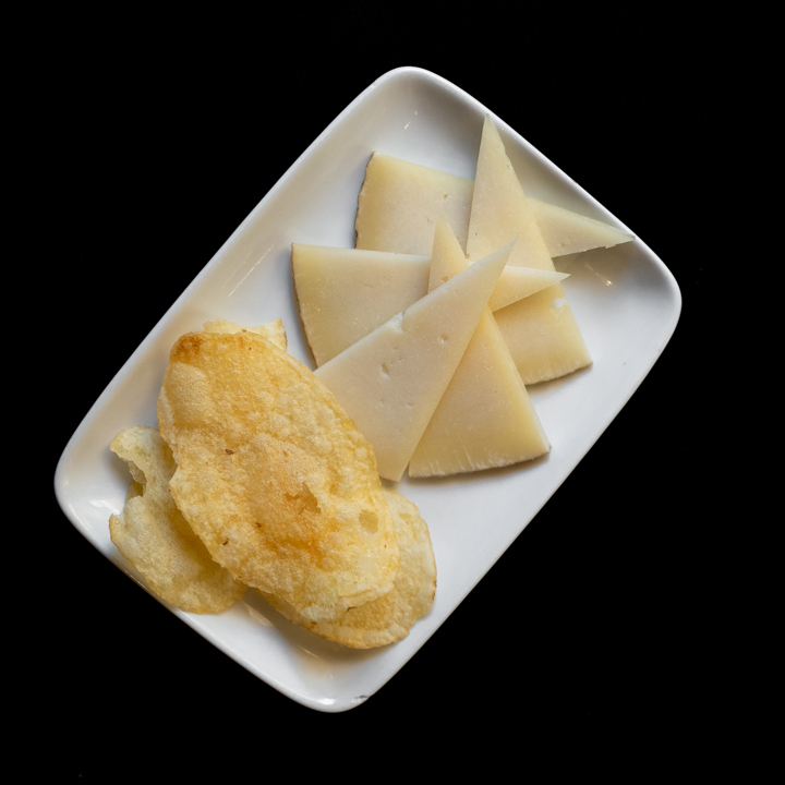 Cured cheese with aromatic herbs oil dressing