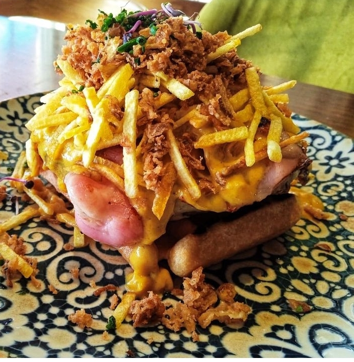 WAFFLE BURGER WITH CHEDAR CHEESE, BACON AND SPICED TACO SAUCE