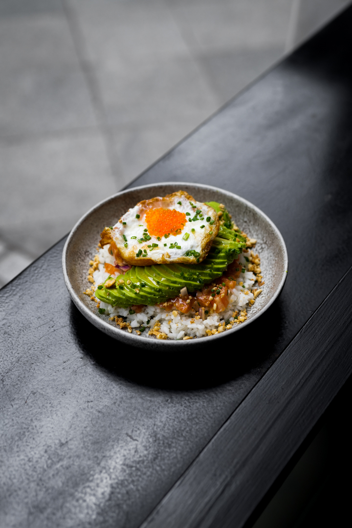 Salmon tartar with avocado, Japanese rice and fried egg