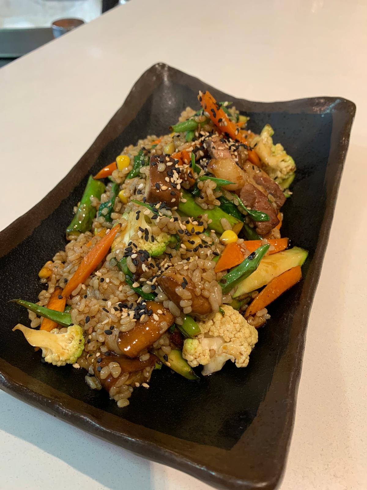 Duck rice, vegetables and ginger oil