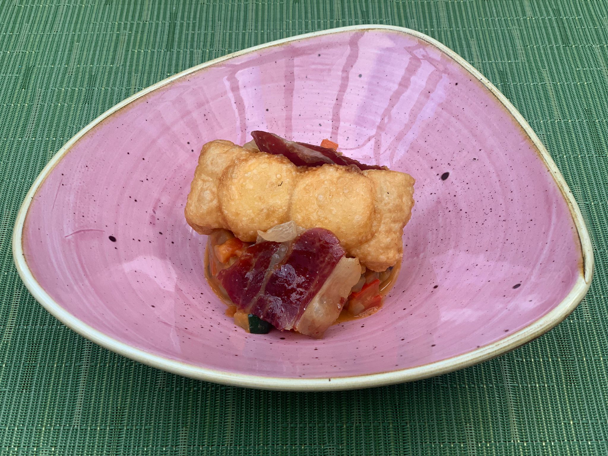 Ratatouille with fried egg and crispy ham