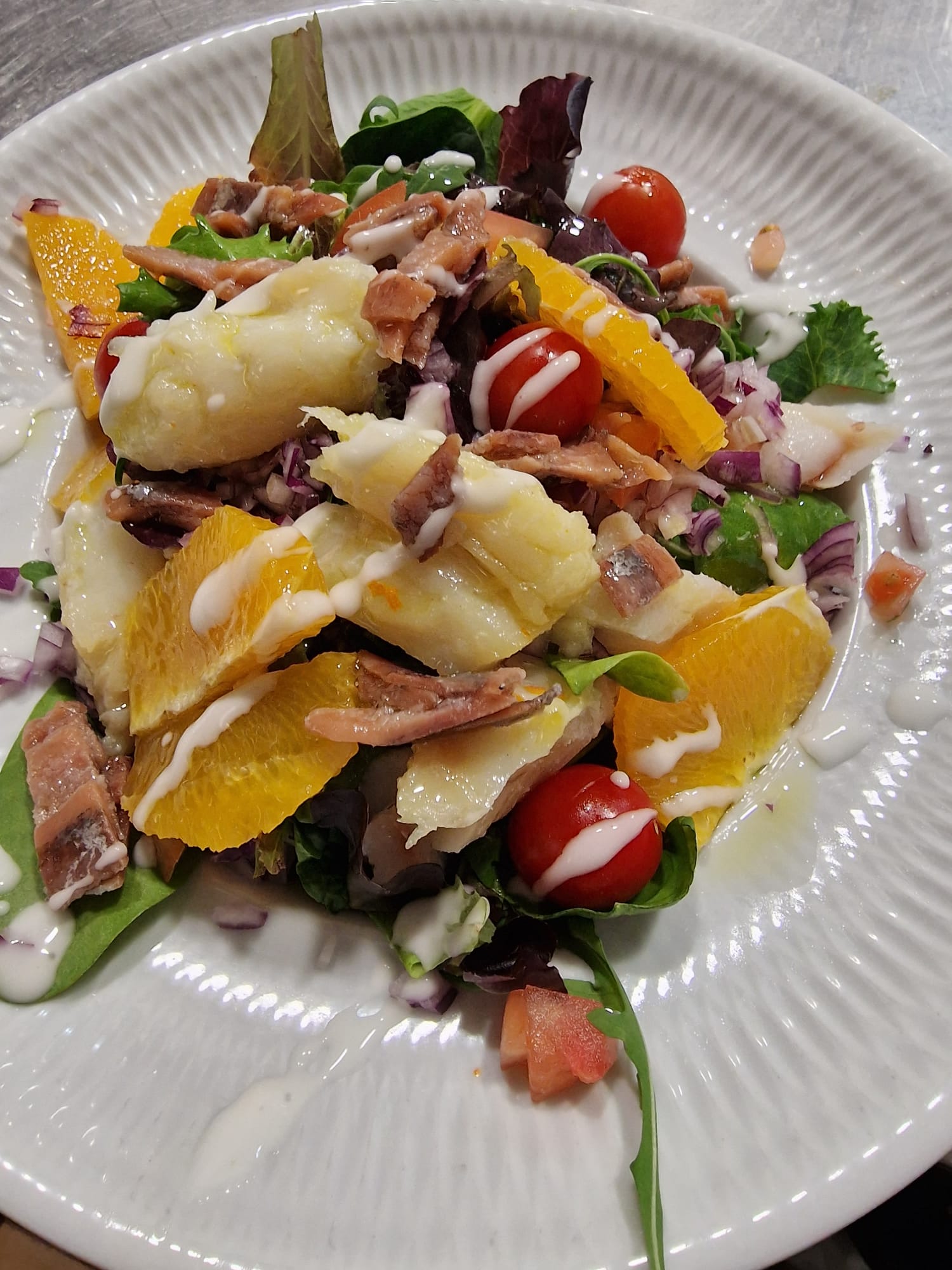 Warm salad of cod, oranges and anchovy vinaigrette