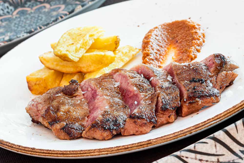 Iberian pork steak on the grill