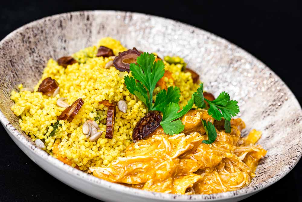Cous cous with vegetables and stewed chicken in its sauce