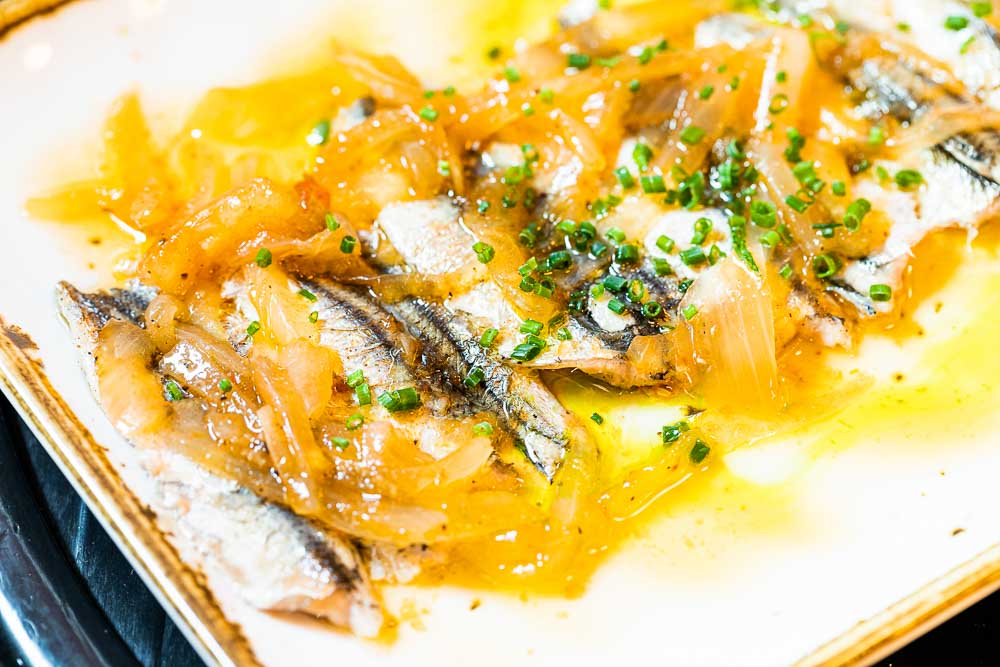 Grilled anchovies with light “escabeche” sauce