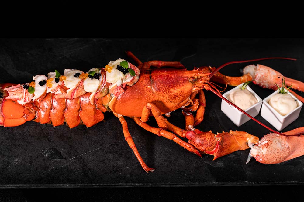 Boiled lobster with sauce assortment