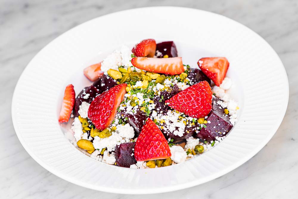 Beetroot salad, goat cheese, strawberries and pistachios