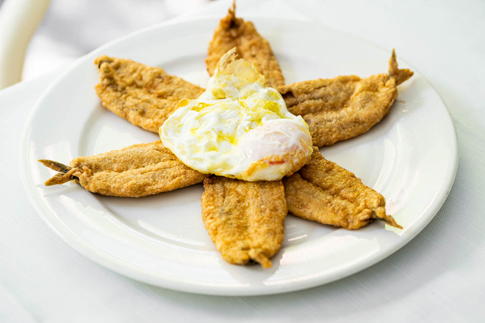 Fried anchovies with fried egg