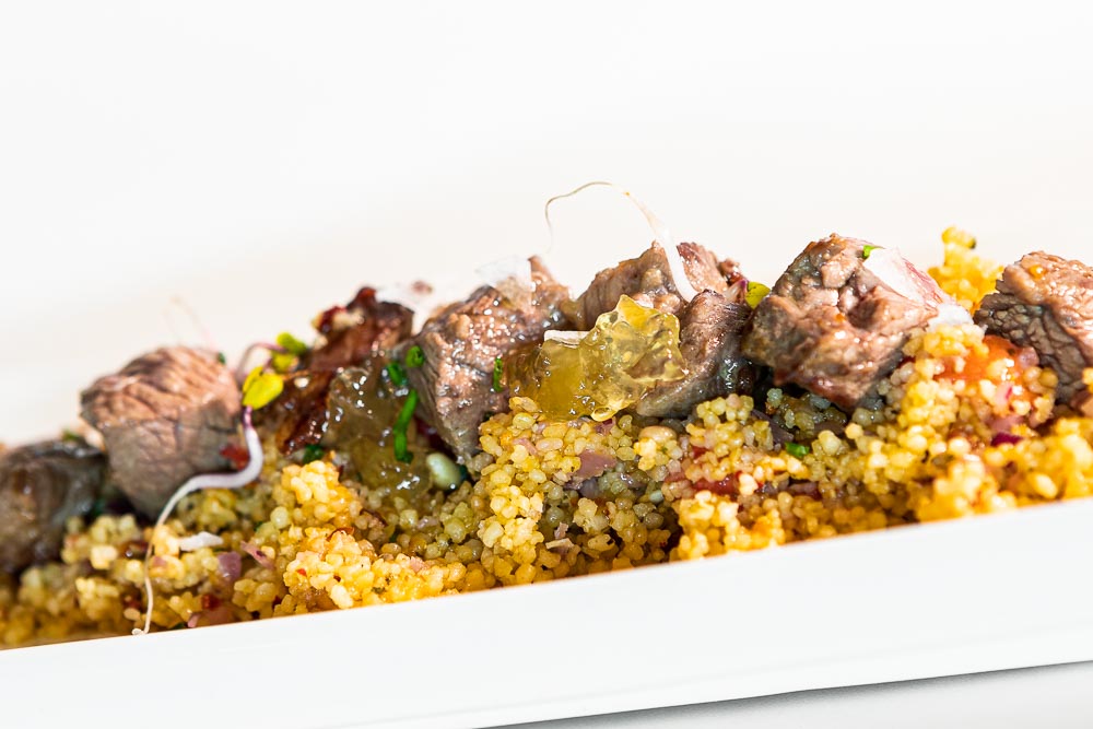 Iberian pork couscous with strawberries and ginger marmalade