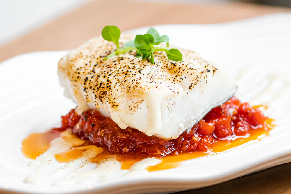 Baked cod with ajoblanco gratin and confit tomato