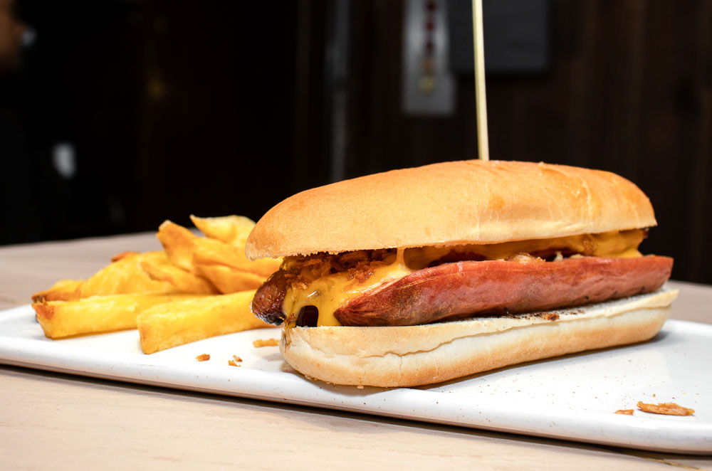 Hot dog: sausage, cheddar, bacon, crispy onion, sauces