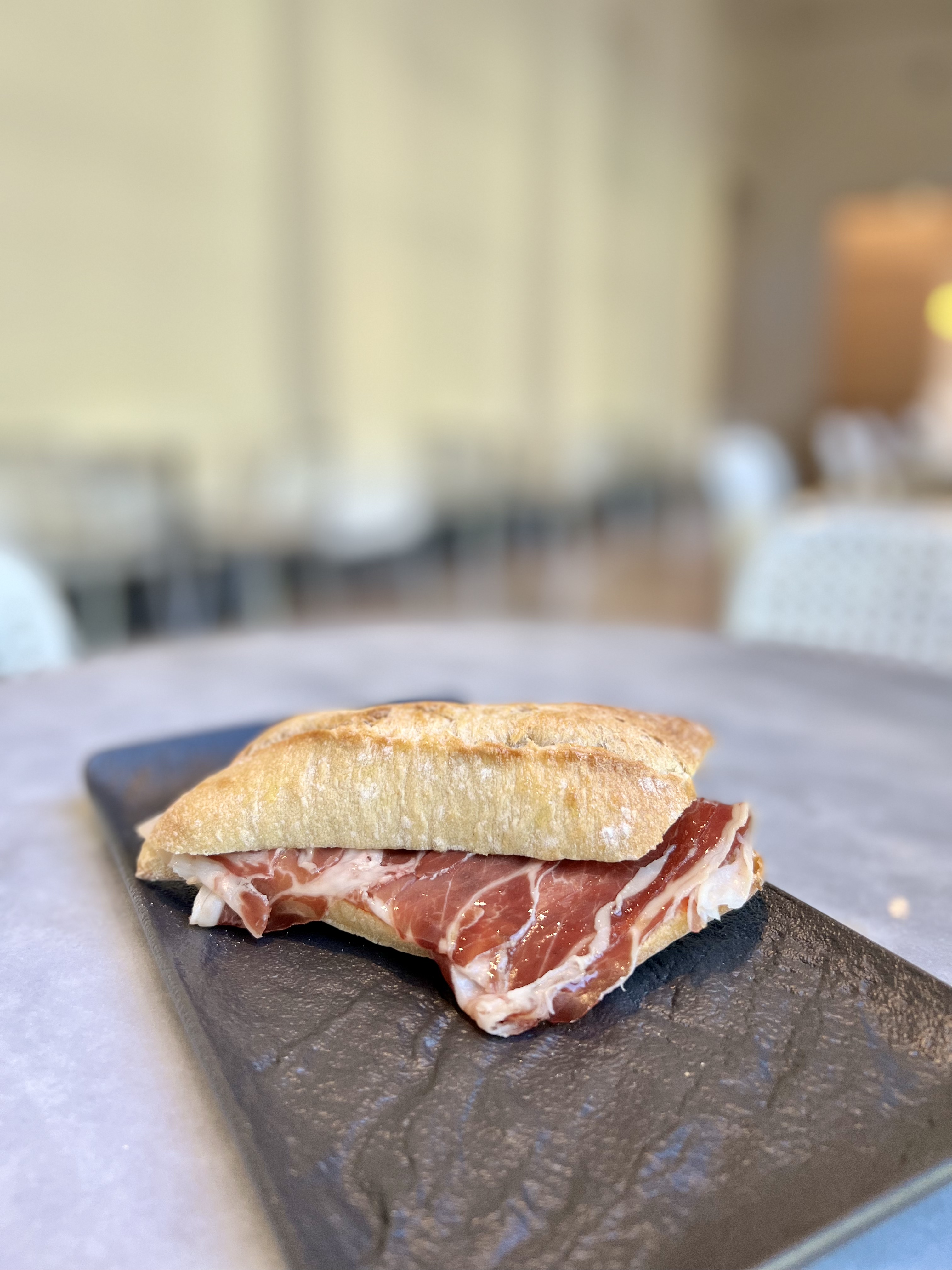 Toasted bar of Iberian ham, tomato and extra virgin olive oil
